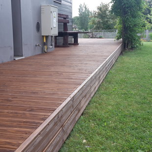 Wooden terrace, tinted oil larch planks